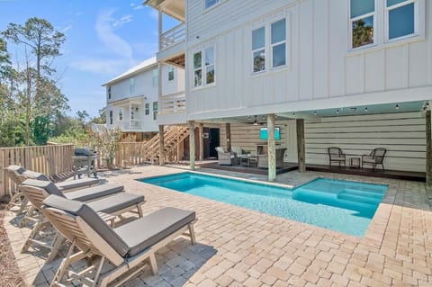 Sun-soaked poolside retreat with ample lounge seating