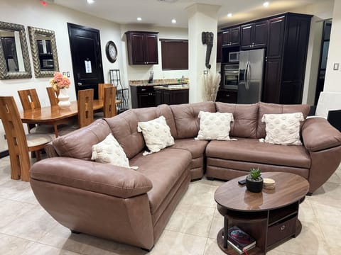 Comfortable living room with sectional sofa and open layout