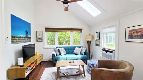 Living room with comfortable seating and large flat screen TV