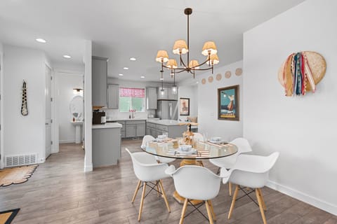 Dining room with seating for 8 between the table and the kitchen island