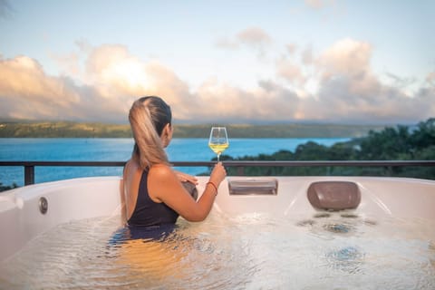 Relax in the private hot tub and enjoy the lake and mountain view.