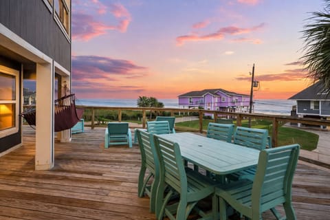 Private deck with outdoor dining and panoramic ocean views, perfect for sunset meals in Galveston beach house rental.