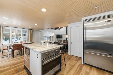 Large kitchen island with open flow into dining area