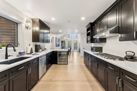Fully stocked kitchen with everything needed to cook a meal at home.