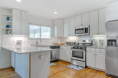 Beautifully designed kitchen with updated appliances and plenty of space for any meal.