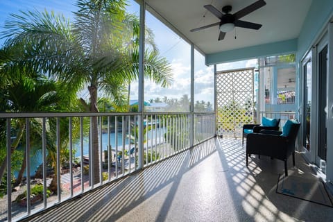 Private Balcony | Large corner balcony with ample seating, rooftop lounge access, and lovely views.