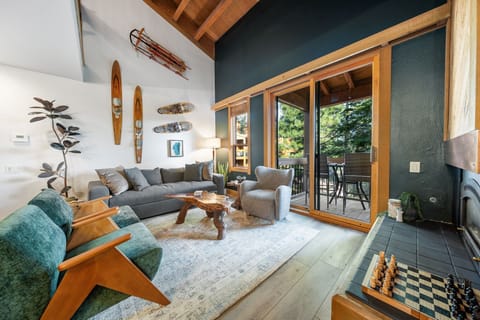 The living area opens up to a covered balcony