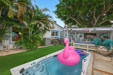 Soak under the palms in your private backyard swim spa.
