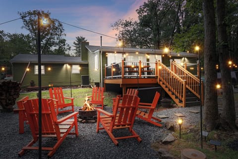 Outdoor firepit surrounded by solar string lights 