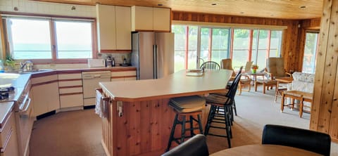Looking into the kitchen and living room from the dining area.