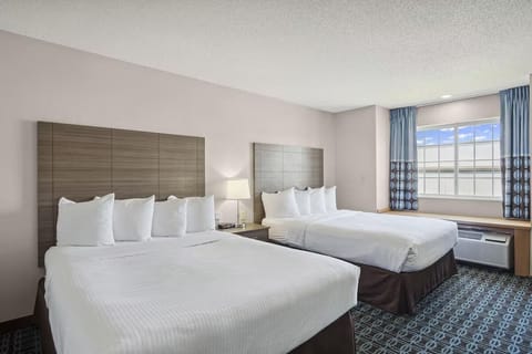 Settle into a spacious double-queen room for easy nights.