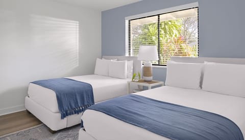 Unwind in airy twin beds with crisp linens.