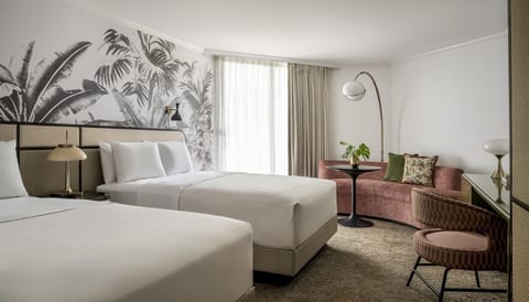 Settle into crisp linens and tropical décor in a bright room.