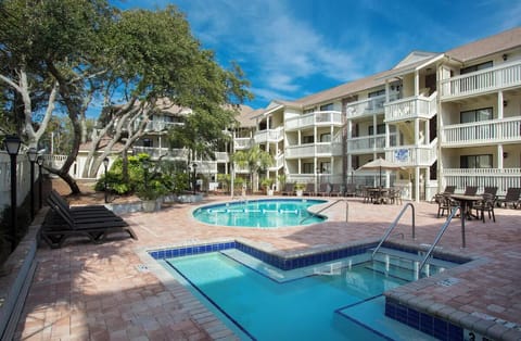 Unwind poolside with shady loungers and breezy courtyard vibes.