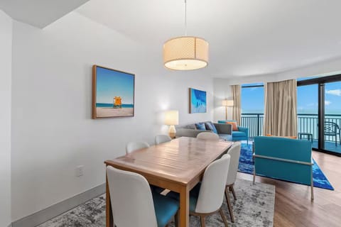 Gather for meals while the ocean glows in view.