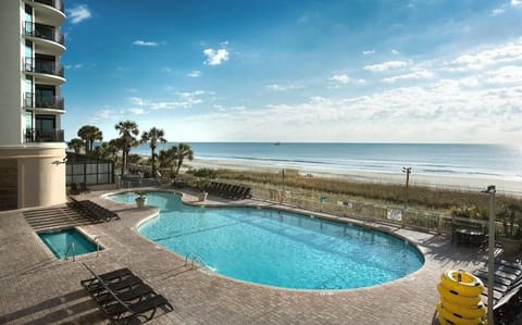 Soak up sweeping beachfront panoramas from the shimmering main pool.