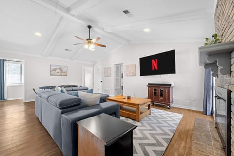 Welcome to your spacious living room with smart TV, and comfortable seating!