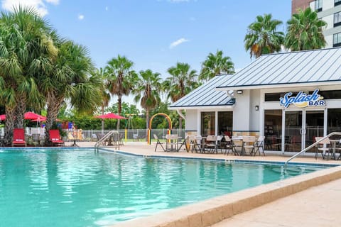 Dive into turquoise waters beside the lively poolside bar.