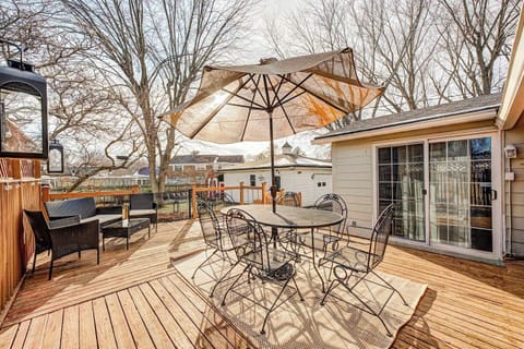 Enjoy the fresh air on the spacious wooden deck! Complete with a large dining table, shaded umbrella, and comfortable lounge seating, it’s the perfect spot for morning coffee or an evening meal overlooking the yard.