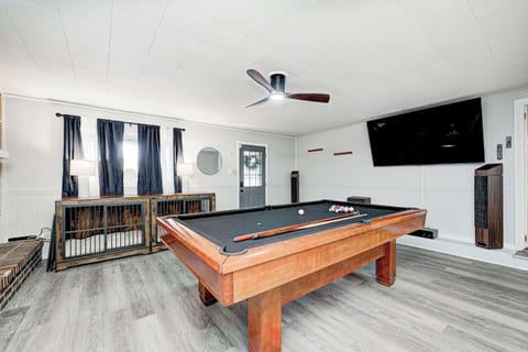 Entertainment central! This spacious room features a full-size pool table, a large smart TV, and a Bluetooth surround system. The open layout and natural light make it the perfect spot for group fun and relaxation.