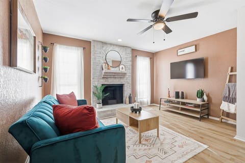 Bright, bold, and full of personality, this cheerful living room is the perfect place for you to sit back, relax, and catch up on your favorite TV shows.