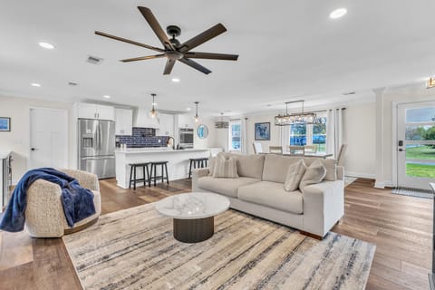 Large open concept highlighting crisp interiors and calming ocean inspired tones