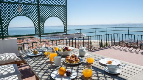Indulge in delightful outdoor meals on this sunny patio, where every bite comes with a spectacular backdrop of the city and the majestic Tagus River.
#PatioDining #RiverfrontViews #LisbonCharm #AlFrescoMeals #SunnyTerrace #PortugalTravel
