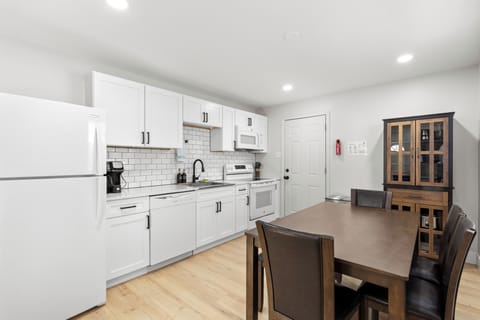 Full sized refrigerator, table and chairs with bench