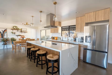 Full kitchen, stocked pantry and plenty of of seating for everyone!