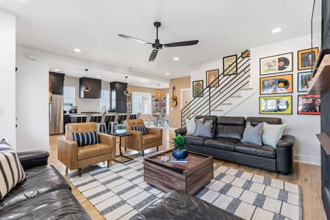 Modern, cozy living room with a gas fireplace, sleeper sofa and a Smart TV with all the streaming apps.