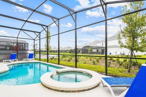 Relax and unwind by the sparkling pool and hot tub, the perfect oasis for a refreshing dip or a soothing soak