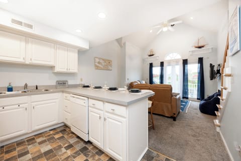 An inviting open layout seamlessly connects the kitchen and living room.