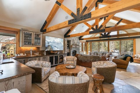 Beautifully appointed and spacious great room with multiple seating areas, wet bar, large flat screen SmartTV, gas fireplace and comfortable furnishings.