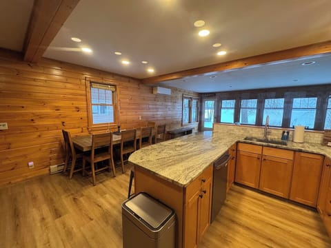 Table seats up to 10 with 4 additional stools at the counter