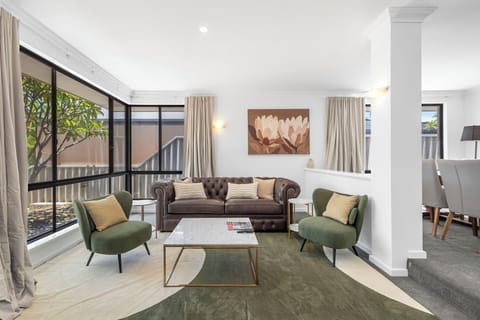 Relax in this beautiful formal living area with comfortable couch and TV.