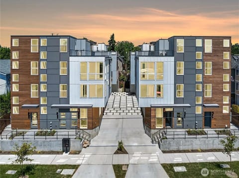 Modern apartment building with contemporary design, private entry, and convenient city access.