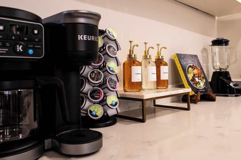 Fully stocked coffee bar with Keurig, syrups, pods, teas and essentials—perfect for starting your mornings with your favorite brew