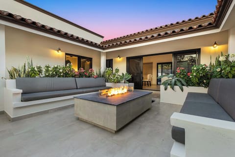 Cozy courtyard with benches and a fire pit, ideal for al fresco nights in Tezal.