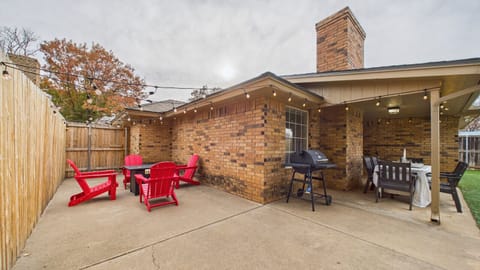 Covered Patio | Outdoor Seating | String Lights | Grill Area