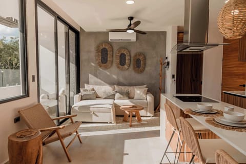 Living room with access to the private balcony with plunge pool 