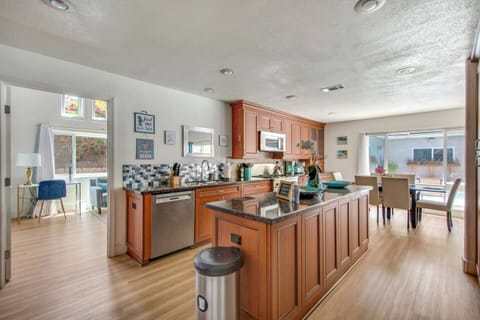 Stainless steel appliances and stocked supplies.