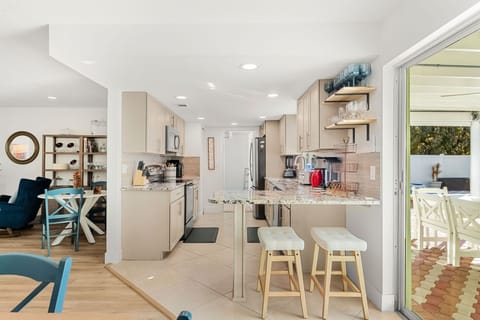 Modern kitchen design with breakfast bar that seats two