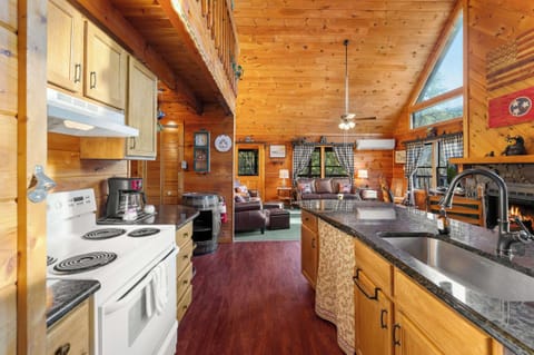 Fully equipped, open-concept kitchen featuring an island with seating and modern appliances