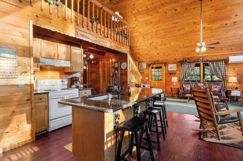 Fully equipped, open-concept kitchen featuring an island with seating and modern appliances