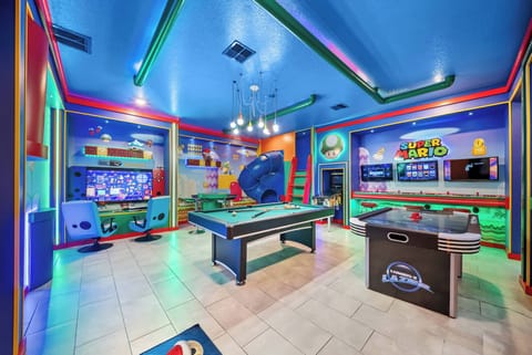 Discover a vibrant game room filled with excitement and playful decor, perfect for adding fun to your stay. Enjoy friendly competitions on the sleek pool table and interactive gaming stations for an unforgettable experience.