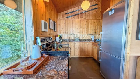 The fully renovated, well-appointed kitchen features granite countertops and stainless steel appliances so you can prepare meals during your stay.