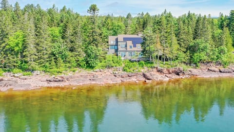 Lake Superior is a force to be reckoned with. The lake can produce waves up to 30 feet high and put on a spectacular show. We call them the Gales of Gitchi Gami and this home on Cascade Beach Road in Lutsen, Minnesota shares their name.