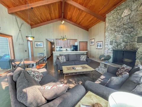 Notre Reve features a living room with a wood-burning fireplace