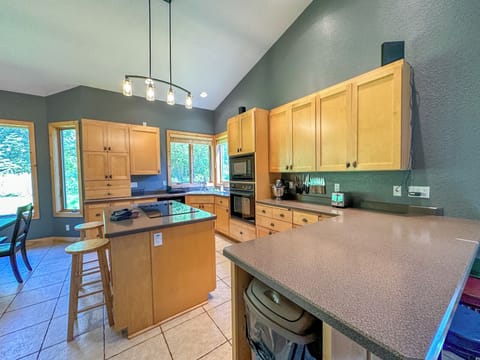 Prepare a home cooked meal in the kitchen.