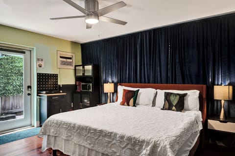Unwind with your favorite streaming entertainment on this studio’s plush king bed​